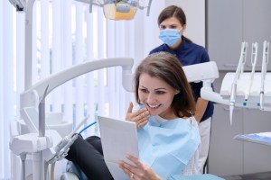 Patient reviewing treatment plan with dentist — personalized All-on-4 implant solution