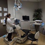 Reston Dentist standing working in exam room