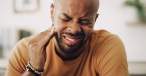 man with dental emergency